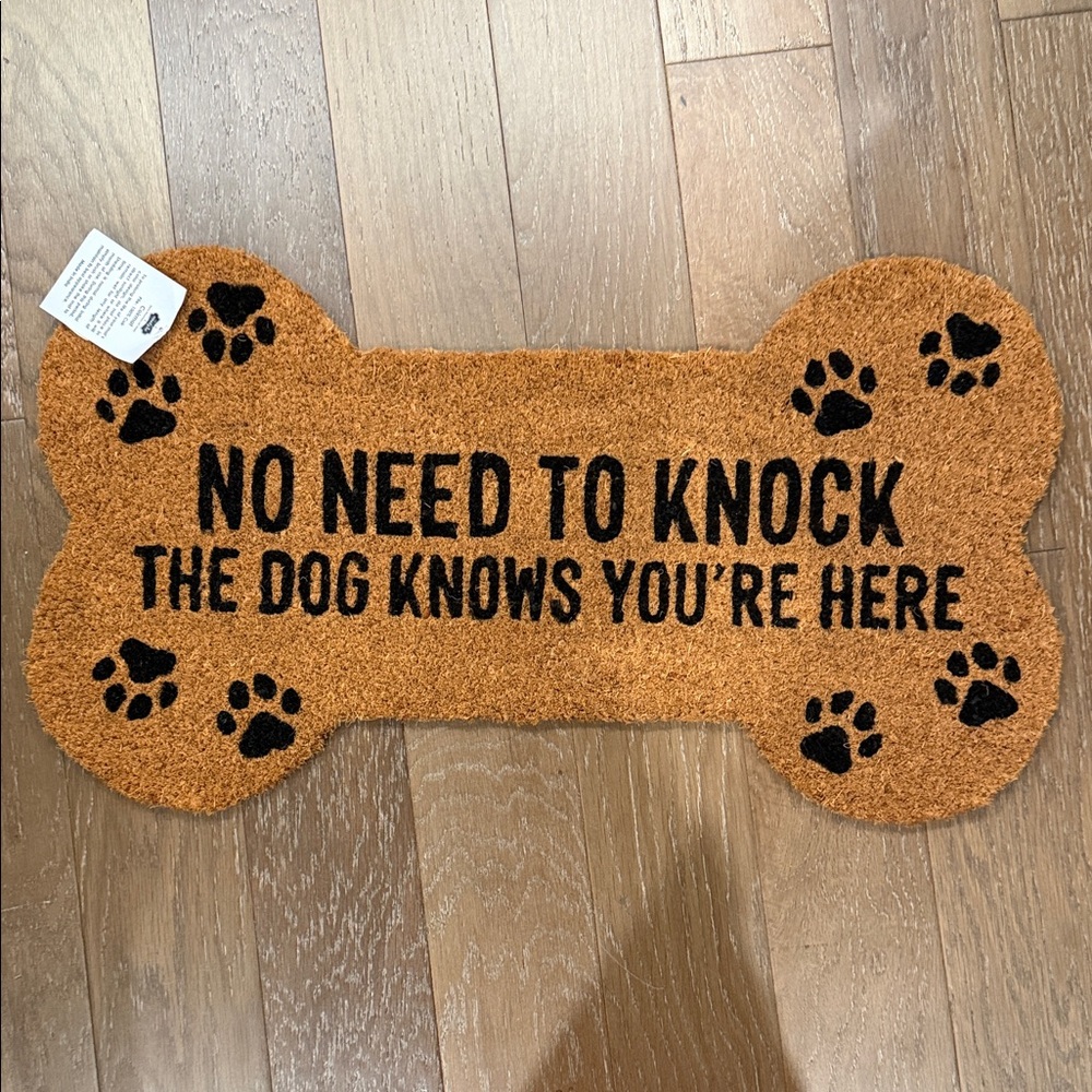 Mud Pie Bone-Shaped Doormat in Brown with Black Paw Print